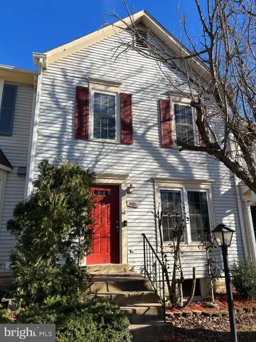 a front view of a house with large windows