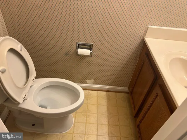 a bathroom with a toilet and a sink