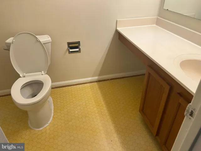 a bathroom with a toilet and a sink