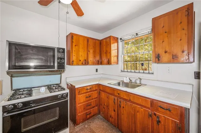a kitchen with a stove and a sink