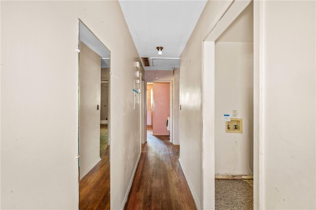 679 Bolton Road Northwest Atlanta, GA 30331 - Photo 13 of 30 a view of a hallway with wooden floor