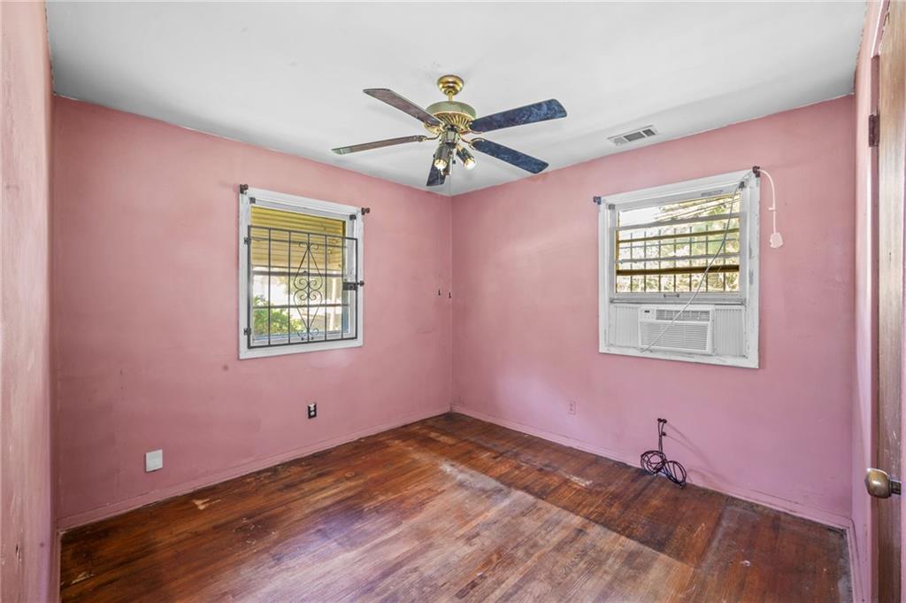 679 Bolton Road Northwest Atlanta, GA 30331 - Photo 16 of 30 a view of a livingroom with a window and a ceiling fan