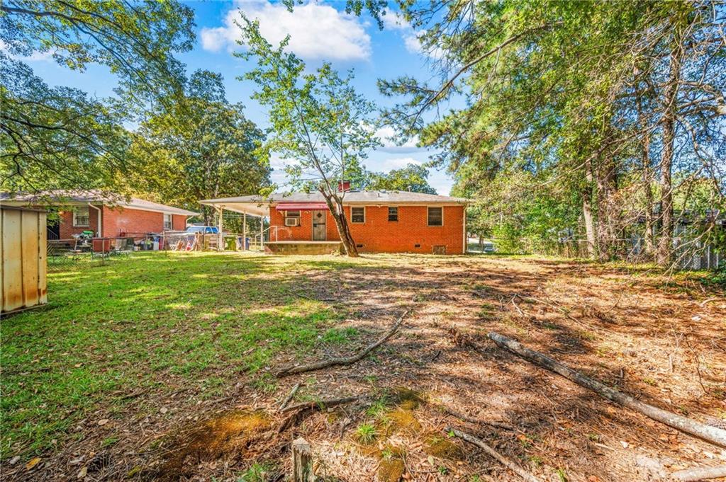 679 Bolton Road Northwest Atlanta, GA 30331 - Photo 26 of 30 a view of a house with a yard