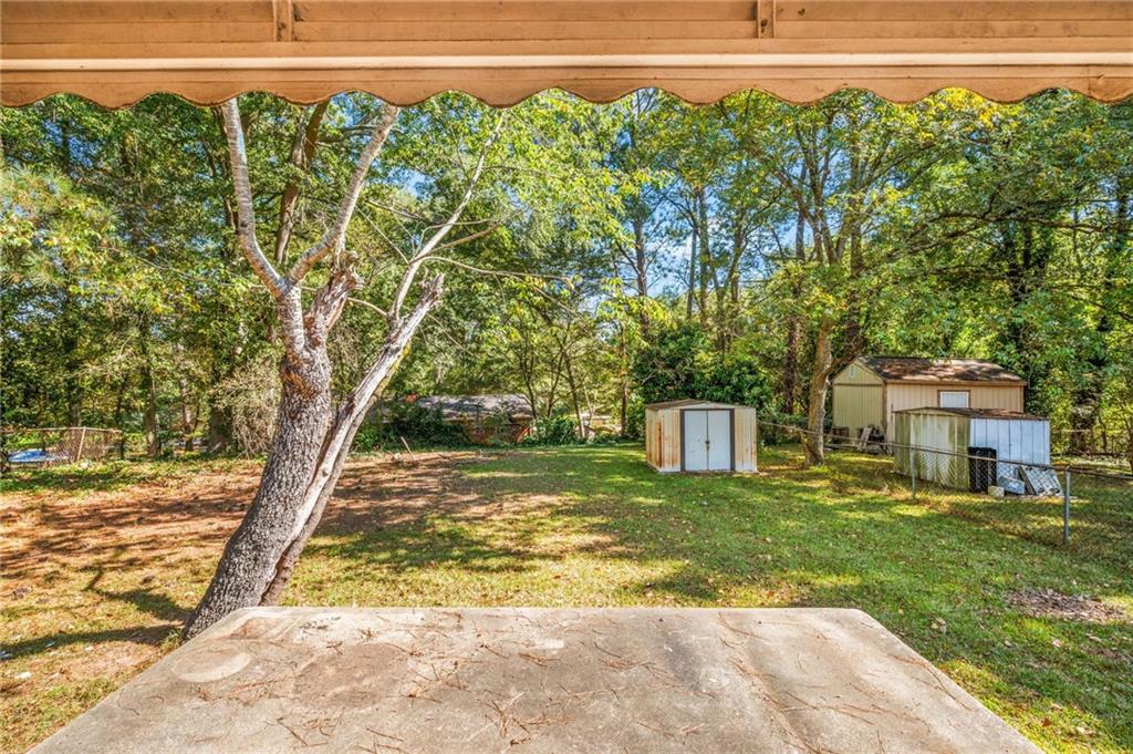 679 Bolton Road Northwest Atlanta, GA 30331 - Photo 28 of 30 a view of a house with a yard