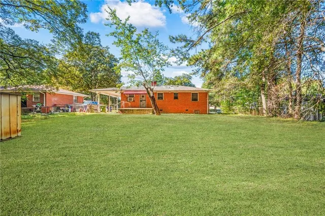 a view of a house with a big yard