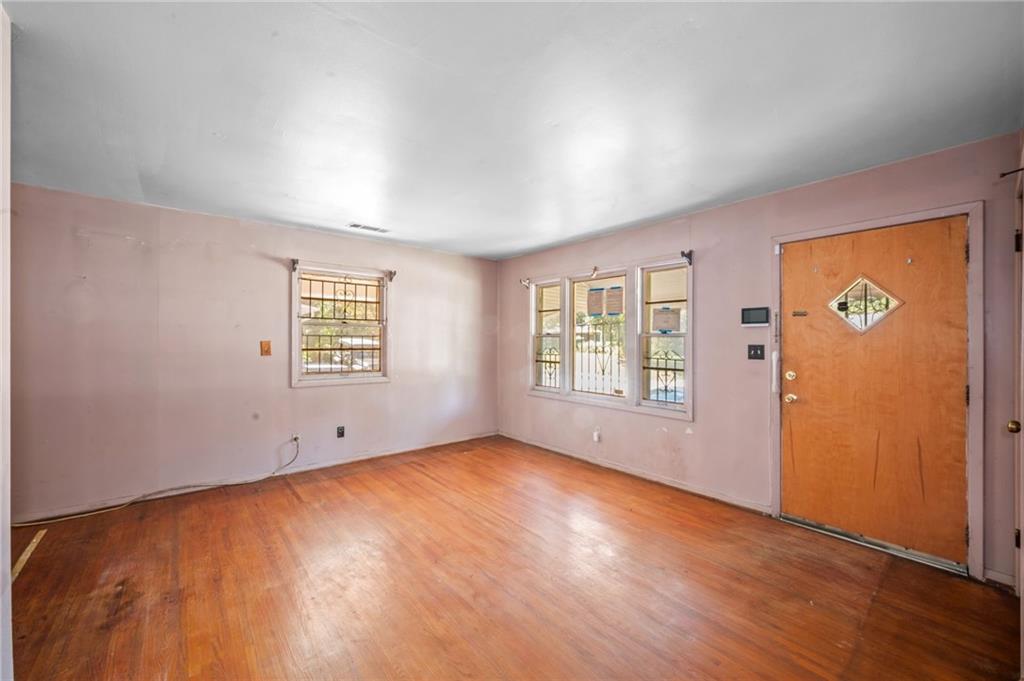 679 Bolton Road Northwest Atlanta, GA 30331 - Photo 5 of 30 an empty room with windows