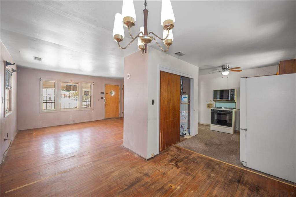 679 Bolton Road Northwest Atlanta, GA 30331 - Photo 8 of 30 wooden floor in an empty room with a window