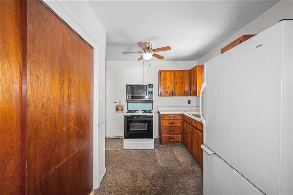 679 Bolton Road Northwest Atlanta, GA 30331 - Photo 10 of 30 a kitchen with stainless steel appliances granite countertop a refrigerator a stove a sink and dishwasher