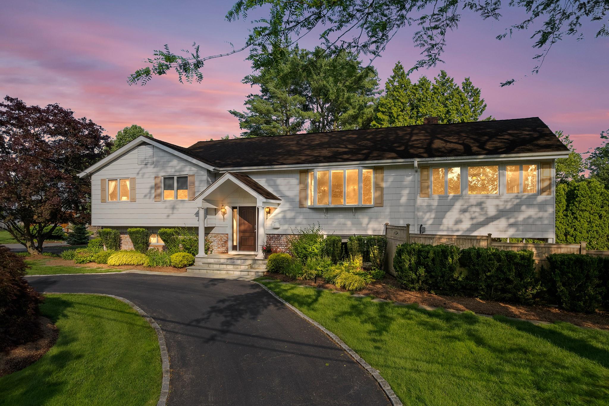 a front view of a house with a yard