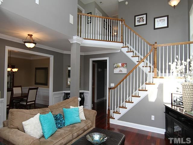 2225 Karns Place Raleigh, NC 27614 - Photo 4 of 23 Your family room offers a gas log fireplace, lots of natural light, neutral colors, windows galore, cherry hardwood floors, huge ceilings, and gorgeous white crown molding. Den/Family/Great Room