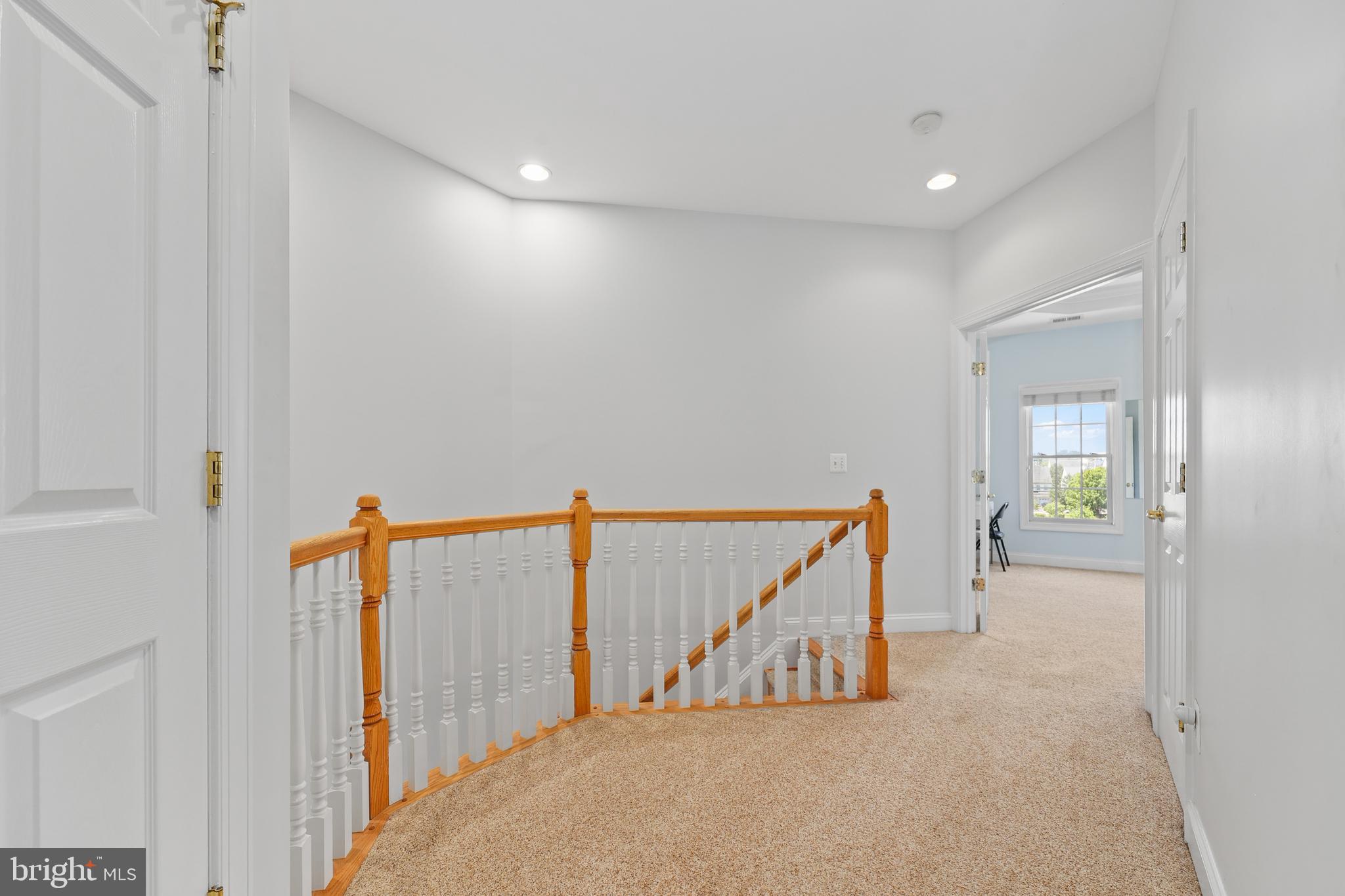 6806 Witton Circle Gainesville, VA 20155 - Photo 15 of 47 a view of a hallway with staircase