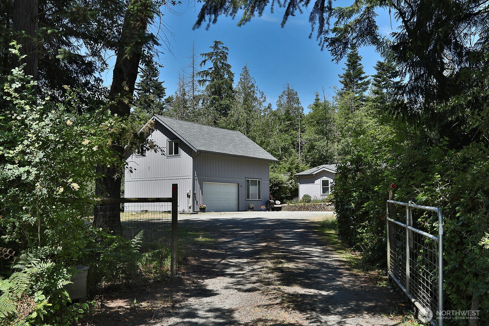 1677 Lancaster Road Freeland, WA 98249 - Photo 1 of 40 a house view with a outdoor space