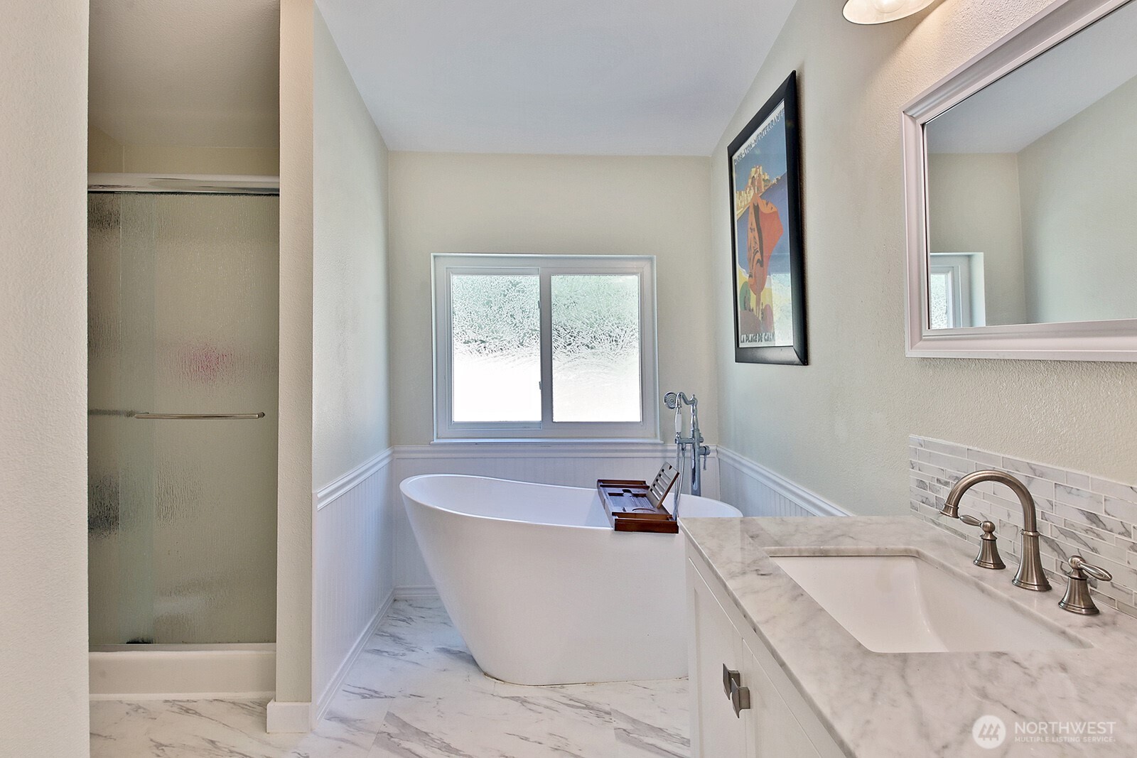 1677 Lancaster Road Freeland, WA 98249 - Photo 21 of 40 a bathroom with a bathtub and shower