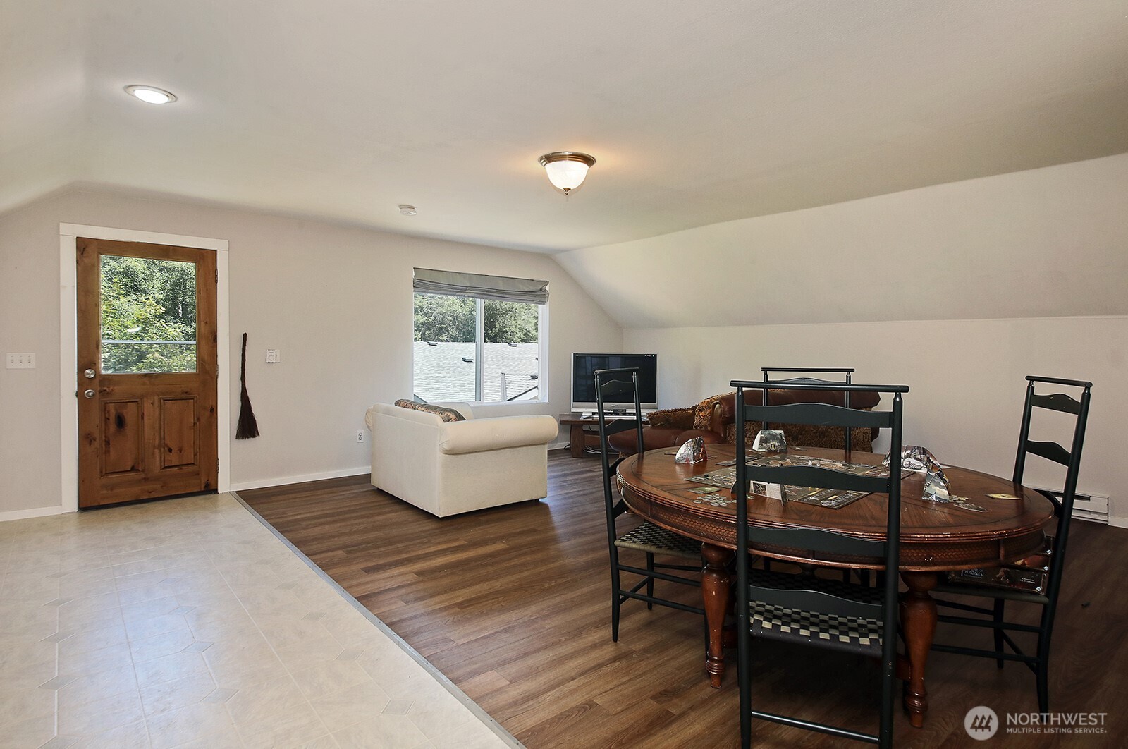 1677 Lancaster Road Freeland, WA 98249 - Photo 32 of 40 a living room with furniture and wooden floor