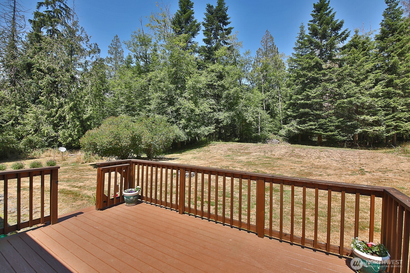 1677 Lancaster Road Freeland, WA 98249 - Photo 35 of 40 a balcony with trees in front of it