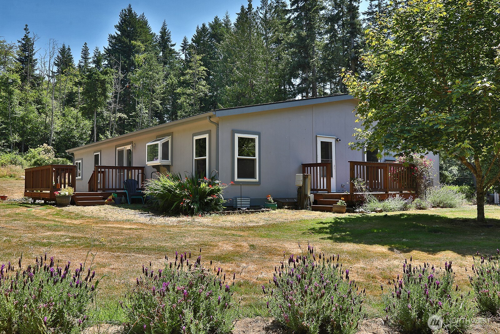1677 Lancaster Road Freeland, WA 98249 - Photo 36 of 40 a front view of house with yard and green space