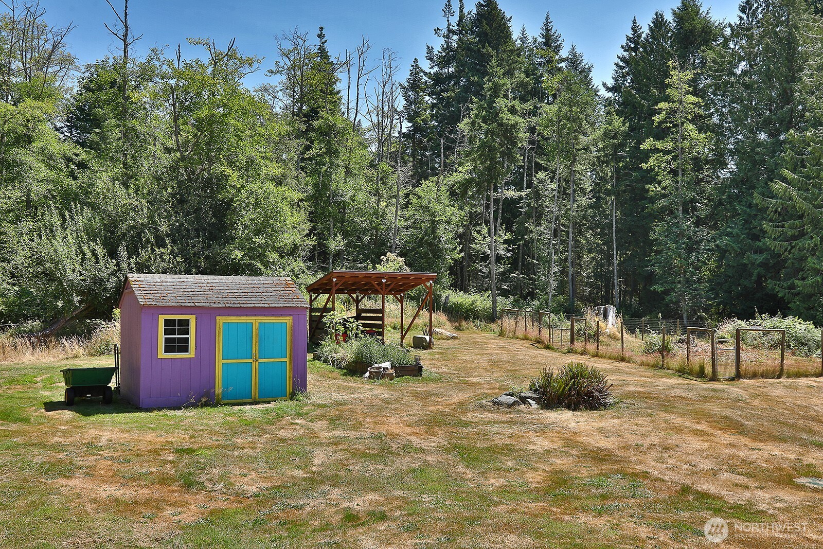 1677 Lancaster Road Freeland, WA 98249 - Photo 37 of 40 a view of a house with a yard