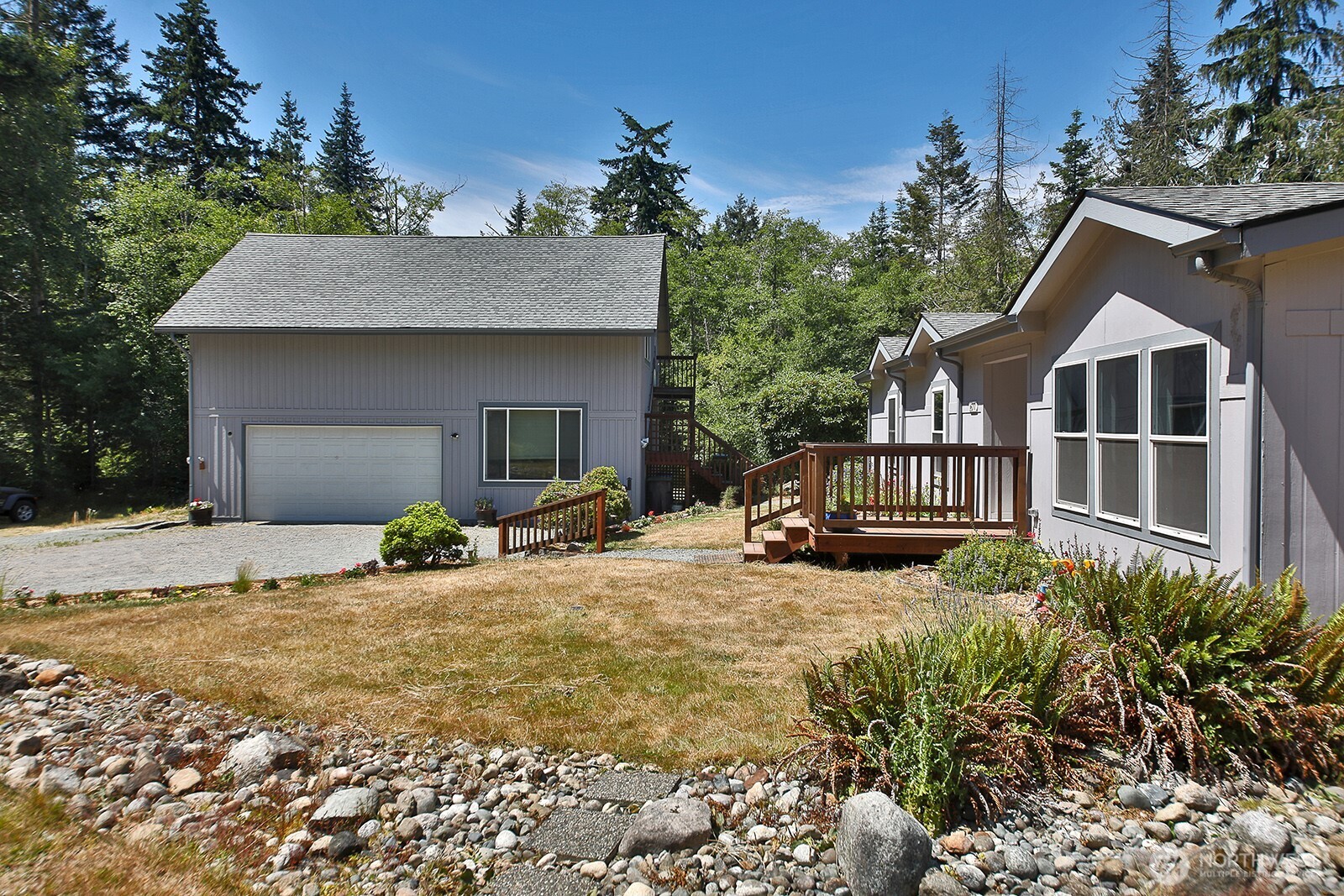 1677 Lancaster Road Freeland, WA 98249 - Photo 5 of 40 a view of a house with backyard and sitting area