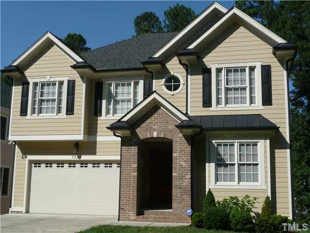 7333 Newport Avenue Raleigh, NC 27613 - Photo 1 of 20 a front view of a house with a yard