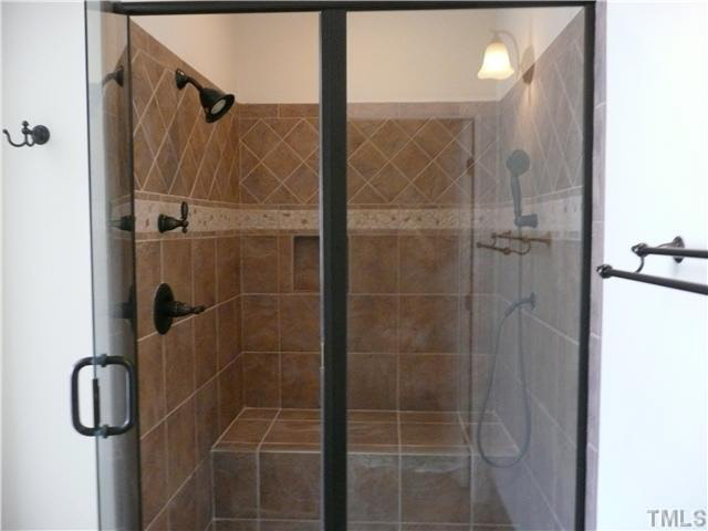 7333 Newport Avenue Raleigh, NC 27613 - Photo 11 of 20 a bathroom with a shower