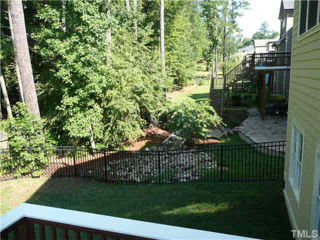 7333 Newport Avenue Raleigh, NC 27613 - Photo 15 of 20 a view of a yard and mountain view
