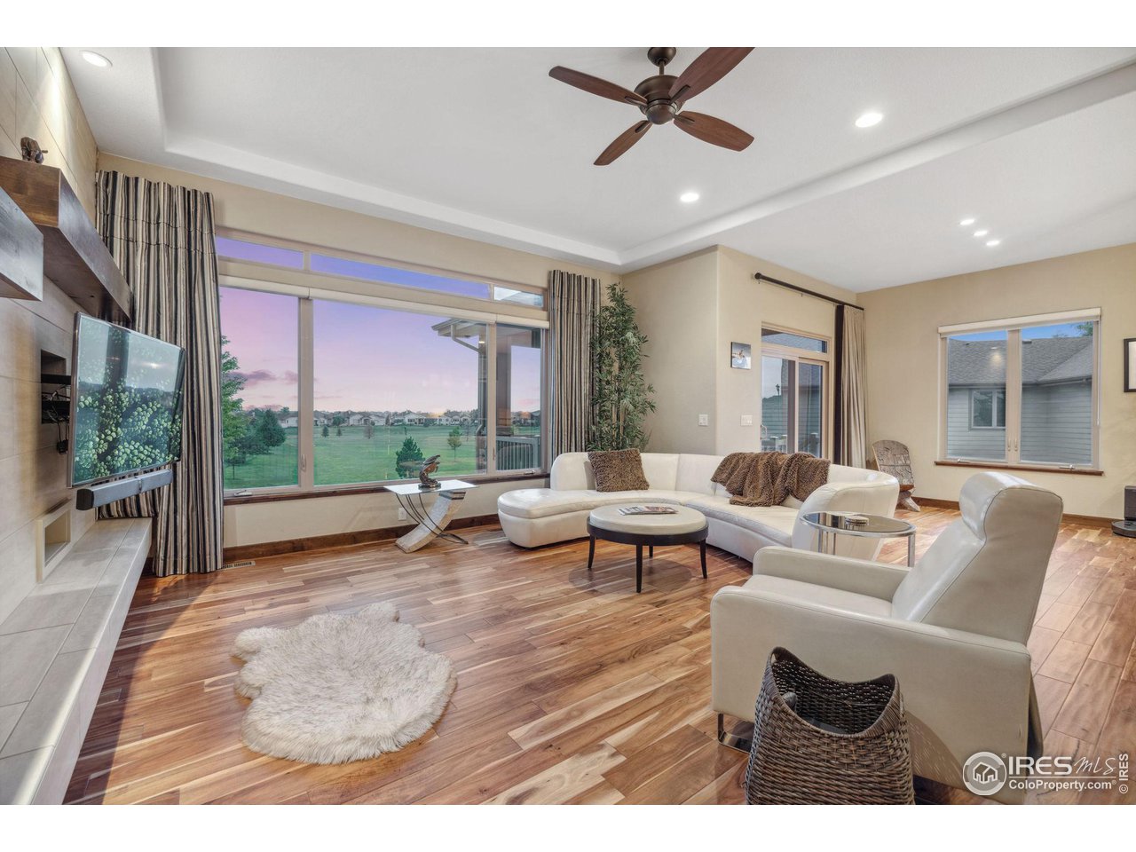 6178 Bay Meadows Drive Windsor, CO 80550 - Photo 15 of 40 a living room with furniture and a large window