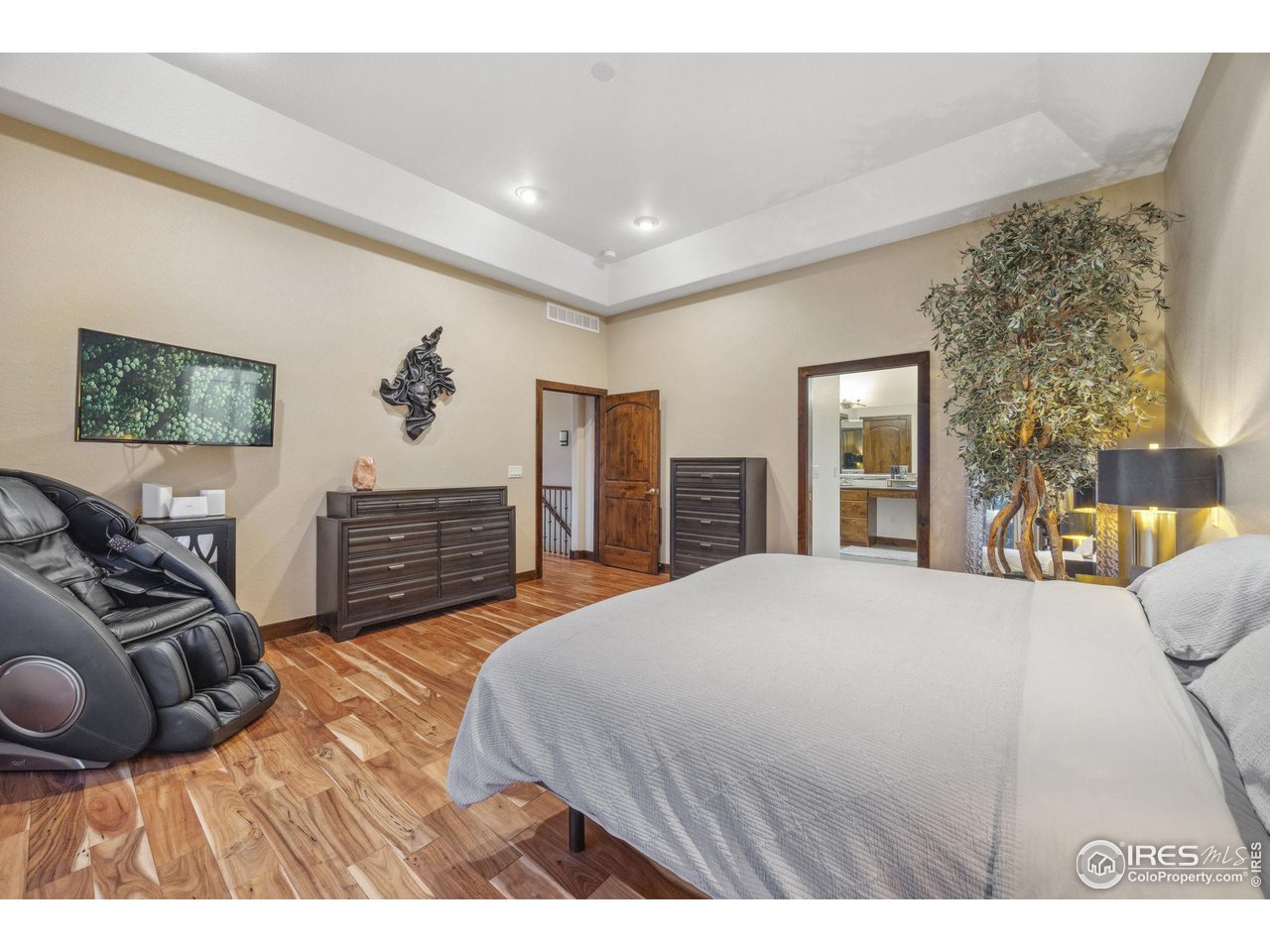 6178 Bay Meadows Drive Windsor, CO 80550 - Photo 21 of 40 a bedroom with a bed and dresser