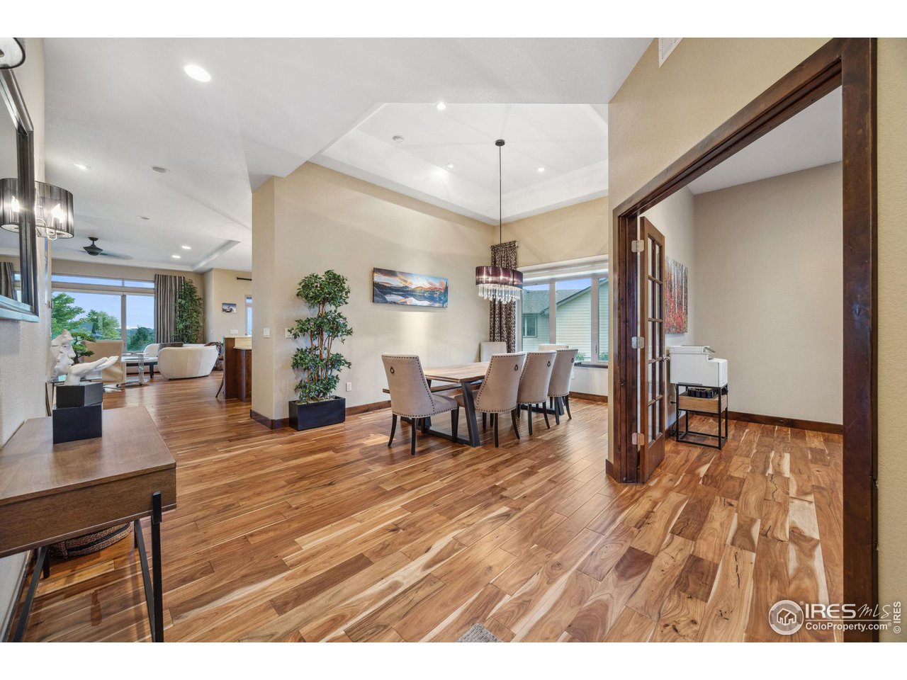 6178 Bay Meadows Drive Windsor, CO 80550 - Photo 8 of 40 a living room with furniture and wooden floor