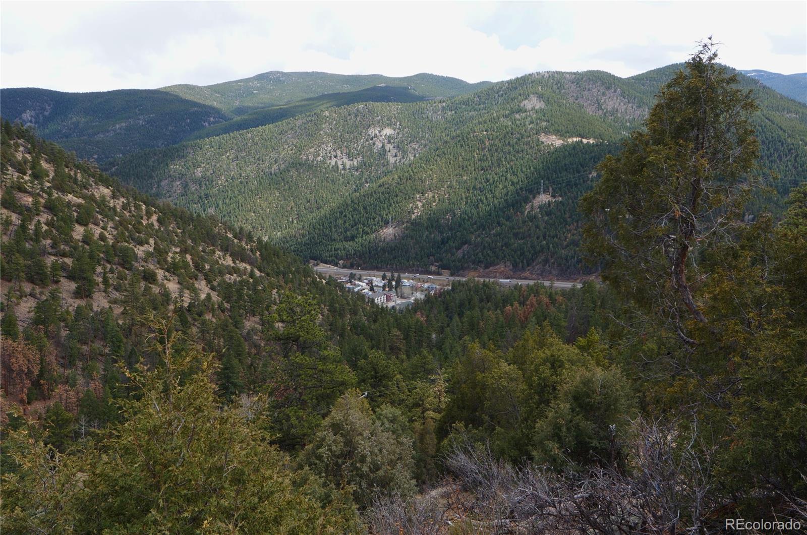 0 Virginia Canyon Road Idaho Springs, CO 80452 - Photo 5 of 45 a view of a mountain with mountains in the background