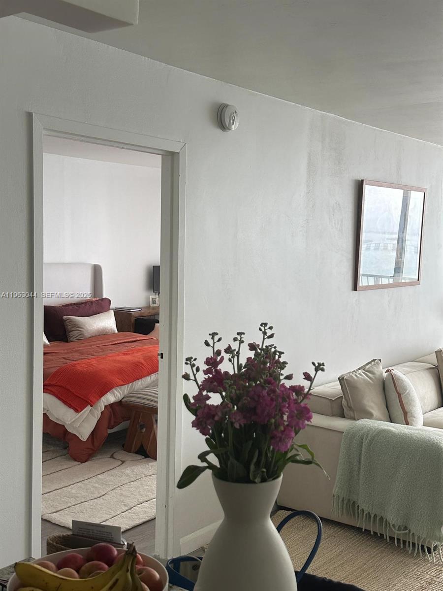 555 Northeast 15th Street, Unit 29G Miami, FL 33132 - Photo 4 of 11 a living room with furniture flowerpot and a rug