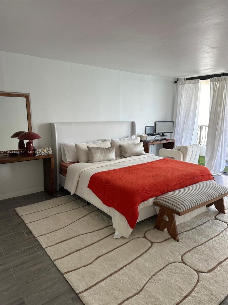 555 Northeast 15th Street, Unit 29G Miami, FL 33132 - Photo 6 of 11 a bedroom with bed and window