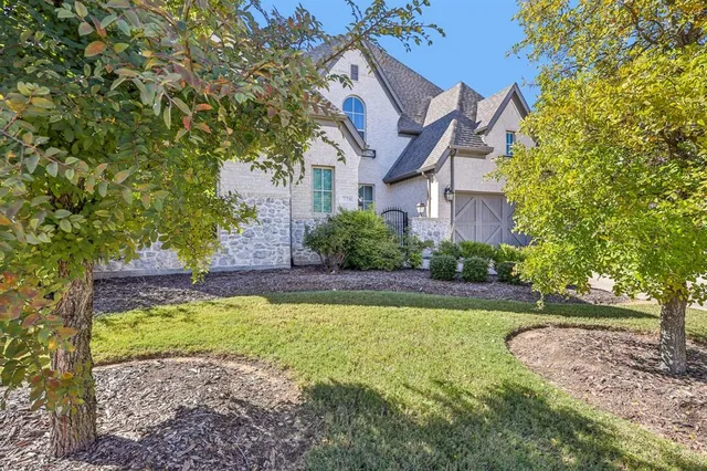 a view of a house with a swimming pool and a yard