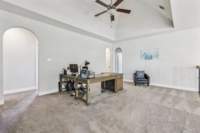 a view of a workspace with furniture