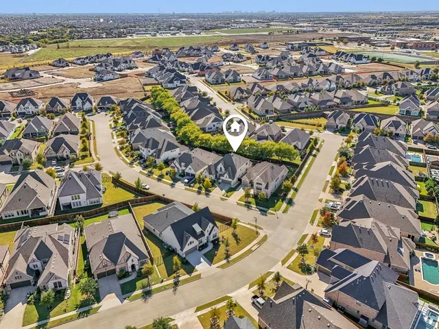 an aerial view of residential building and lake
