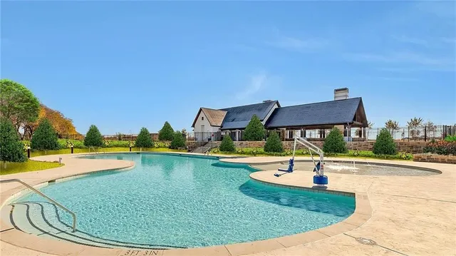 a view of a swimming pool and a yard