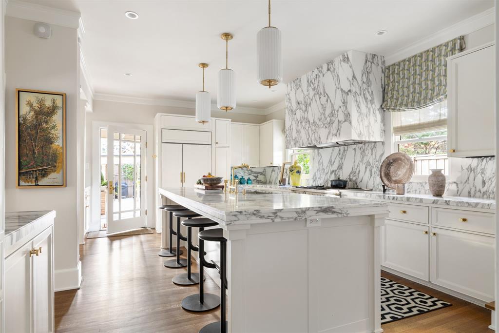 1203 North Windomere Avenue Dallas, TX 75208 - Photo 21 of 40 a kitchen with stainless steel appliances granite countertop a sink a stove and cabinets