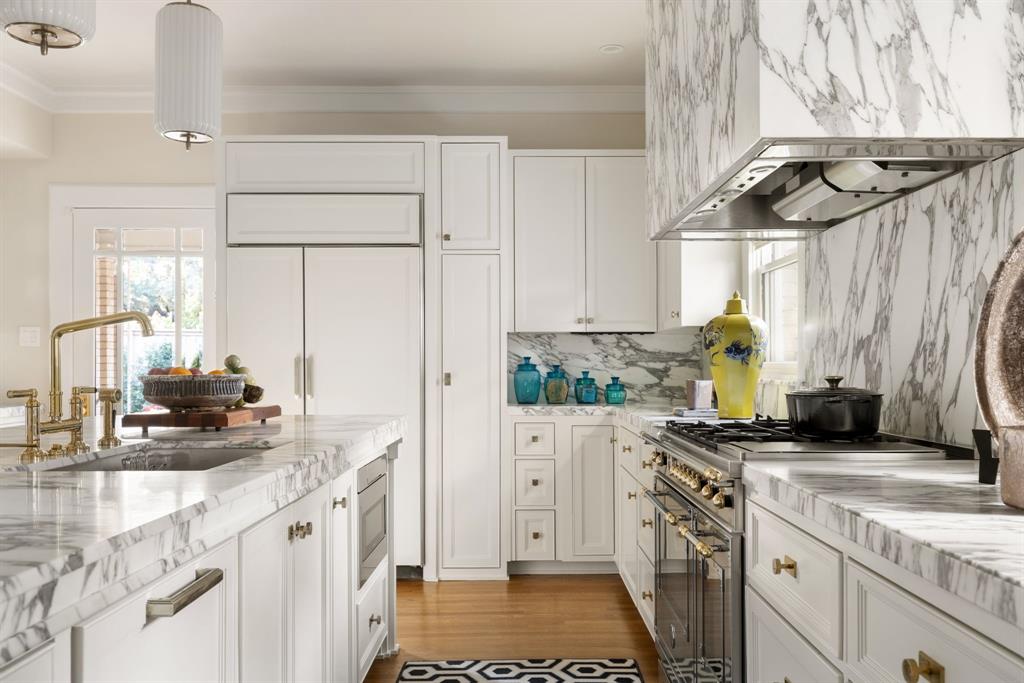 1203 North Windomere Avenue Dallas, TX 75208 - Photo 22 of 40 a kitchen with a sink a stove a refrigerator and cabinets