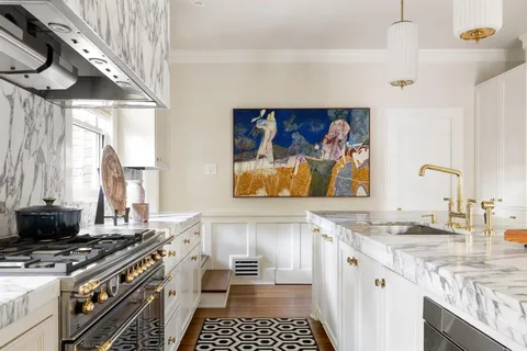 a kitchen with a stove and a sink