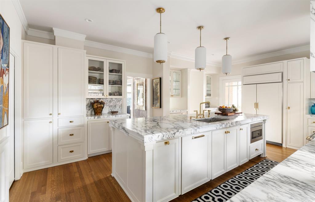 1203 North Windomere Avenue Dallas, TX 75208 - Photo 25 of 40 a kitchen with white cabinets and sink