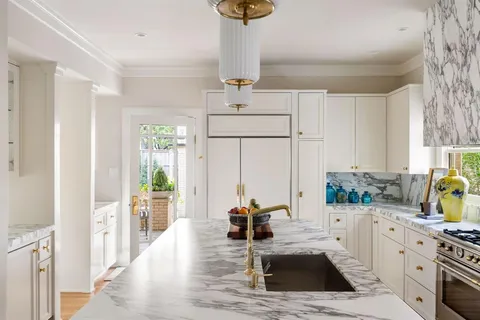 a kitchen with a sink stove and refrigerator