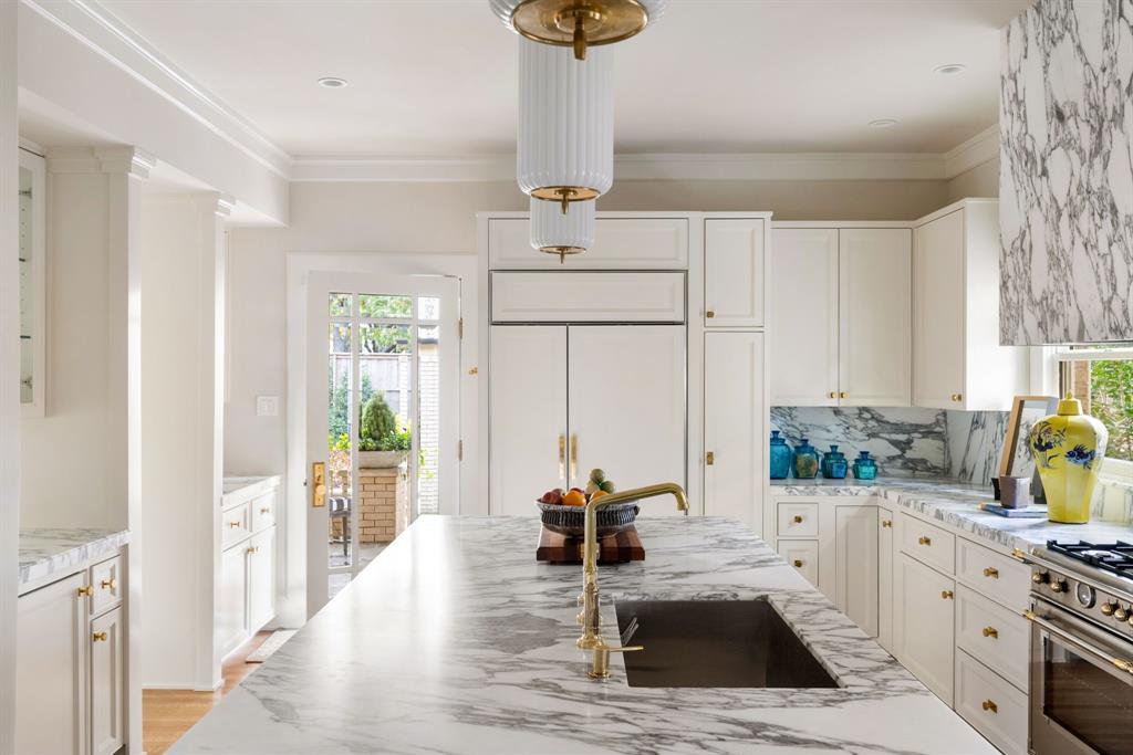 1203 North Windomere Avenue Dallas, TX 75208 - Photo 27 of 40 a kitchen with a sink stove and refrigerator