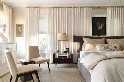 a bedroom with a bed and a couch