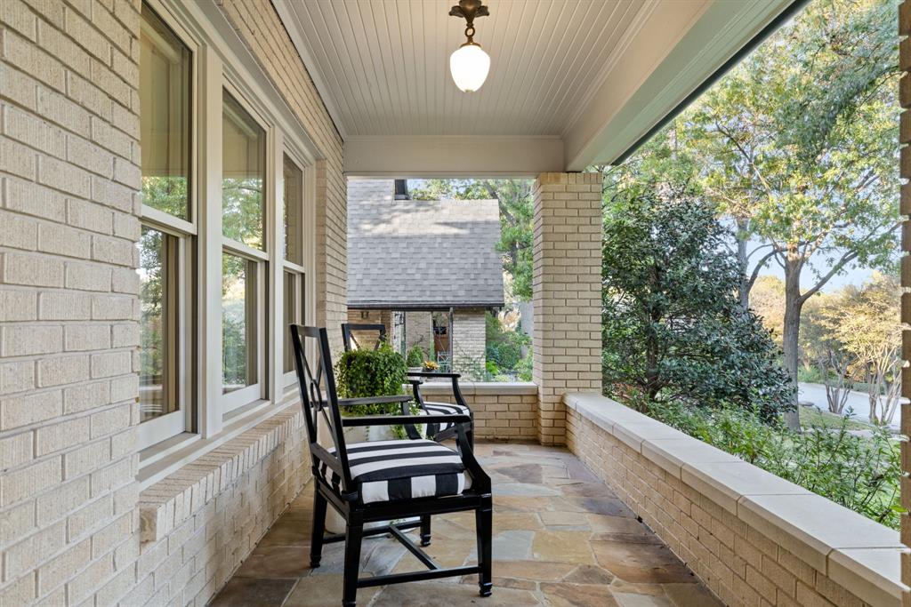 1203 North Windomere Avenue Dallas, TX 75208 - Photo 4 of 40 a view of a porch with furniture and garden