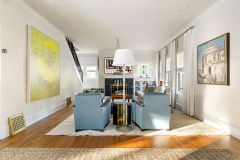 a view of a livingroom with furniture and window