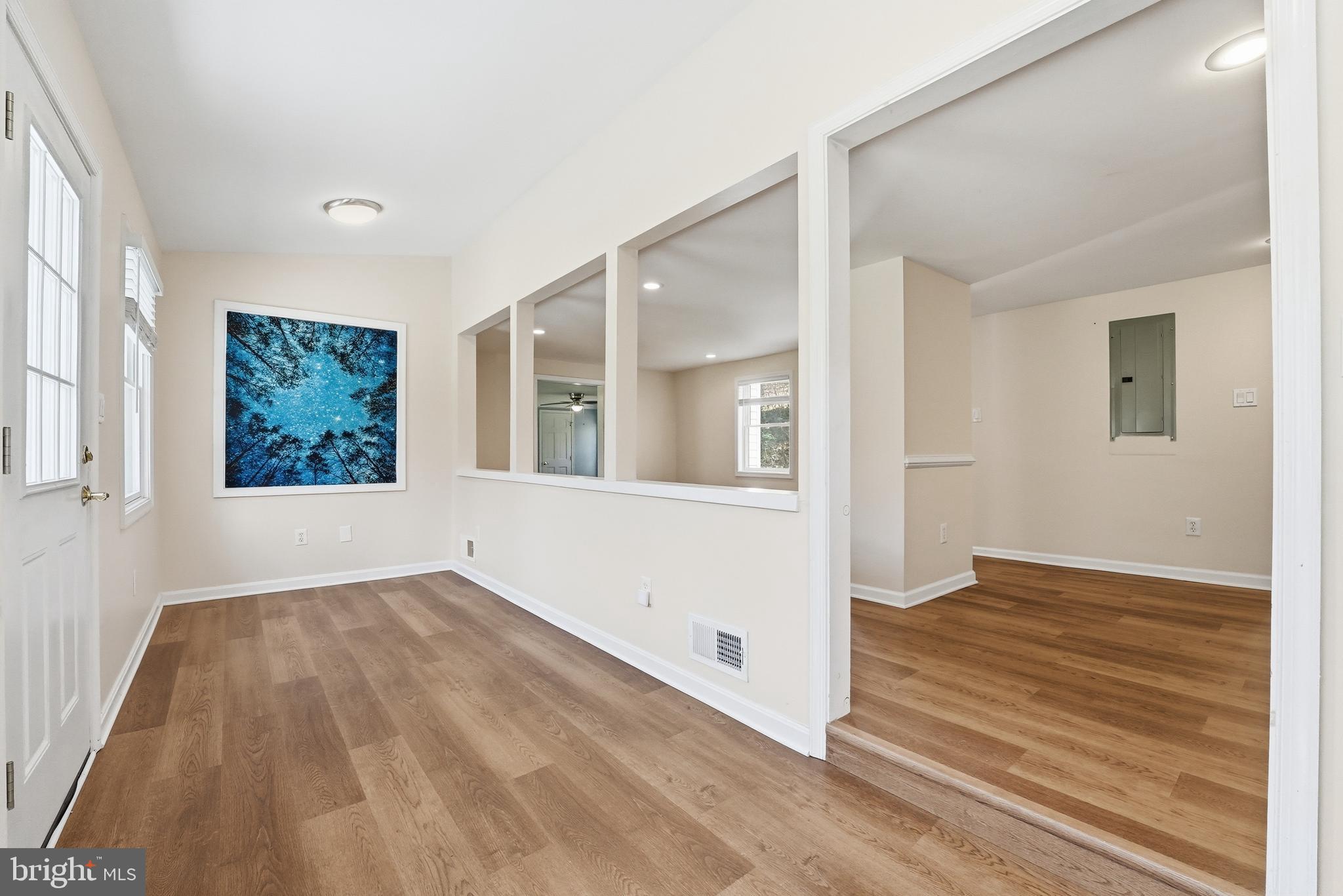 6537 Watery Mountain Road Warrenton, VA 20186 - Photo 11 of 44 a view of an empty room with wooden floor and a window