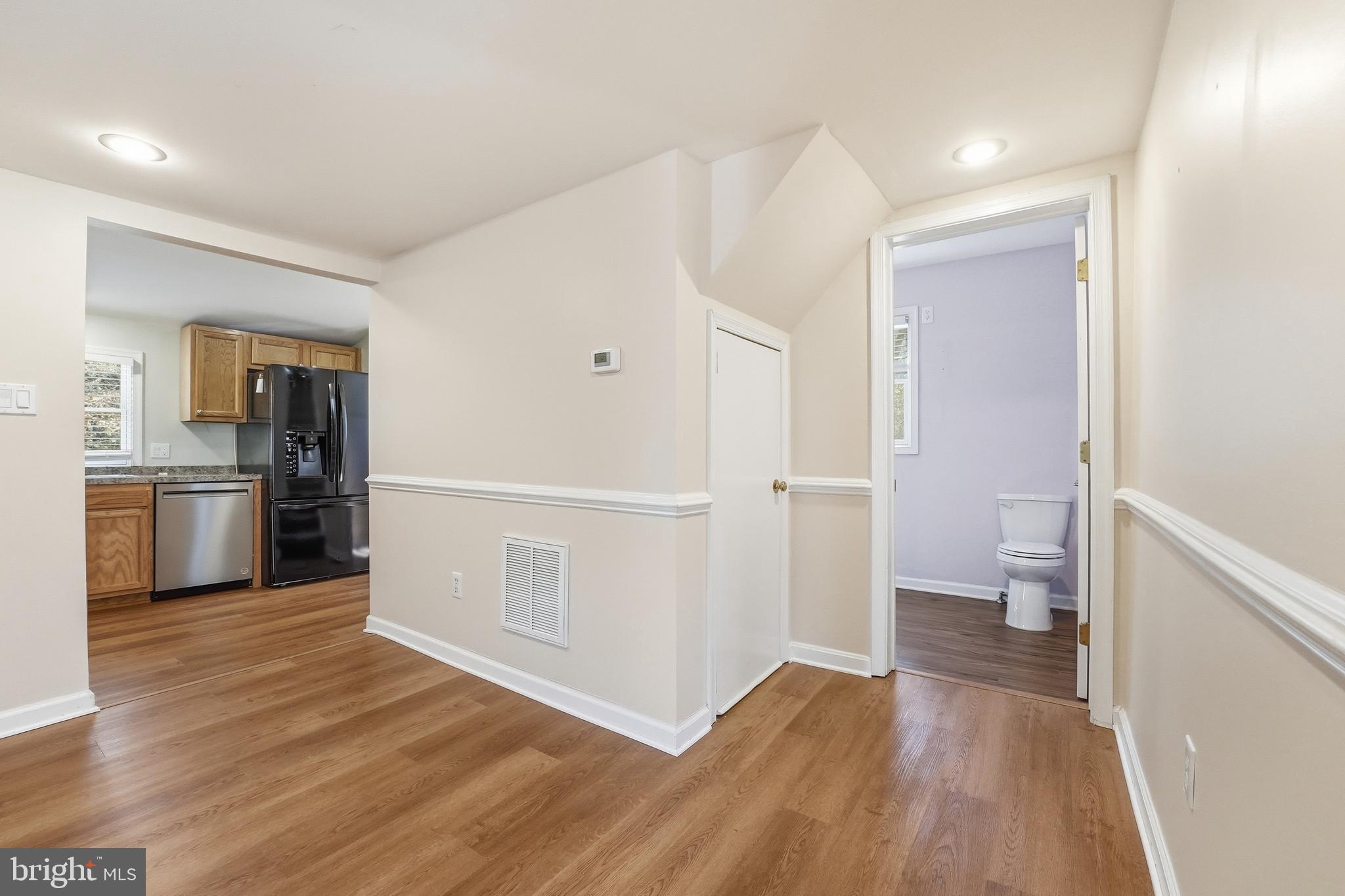 6537 Watery Mountain Road Warrenton, VA 20186 - Photo 14 of 44 a view of an empty room and a kitchen