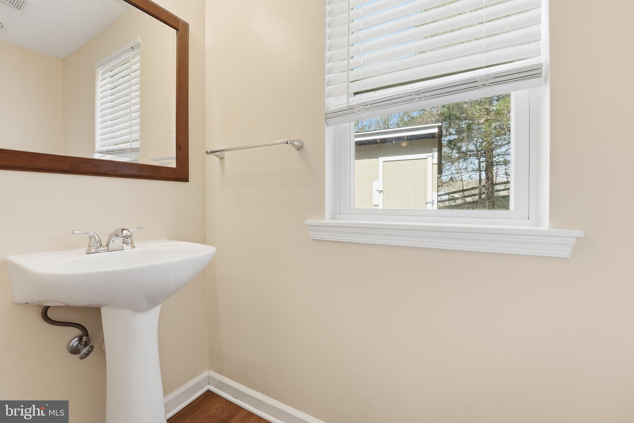 6537 Watery Mountain Road Warrenton, VA 20186 - Photo 19 of 44 a bathroom with a sink and a mirror