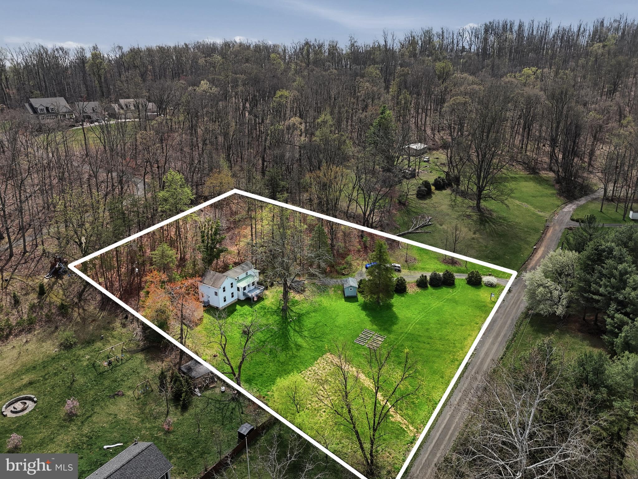 6537 Watery Mountain Road Warrenton, VA 20186 - Photo 2 of 44 a view of a backyard with plants
