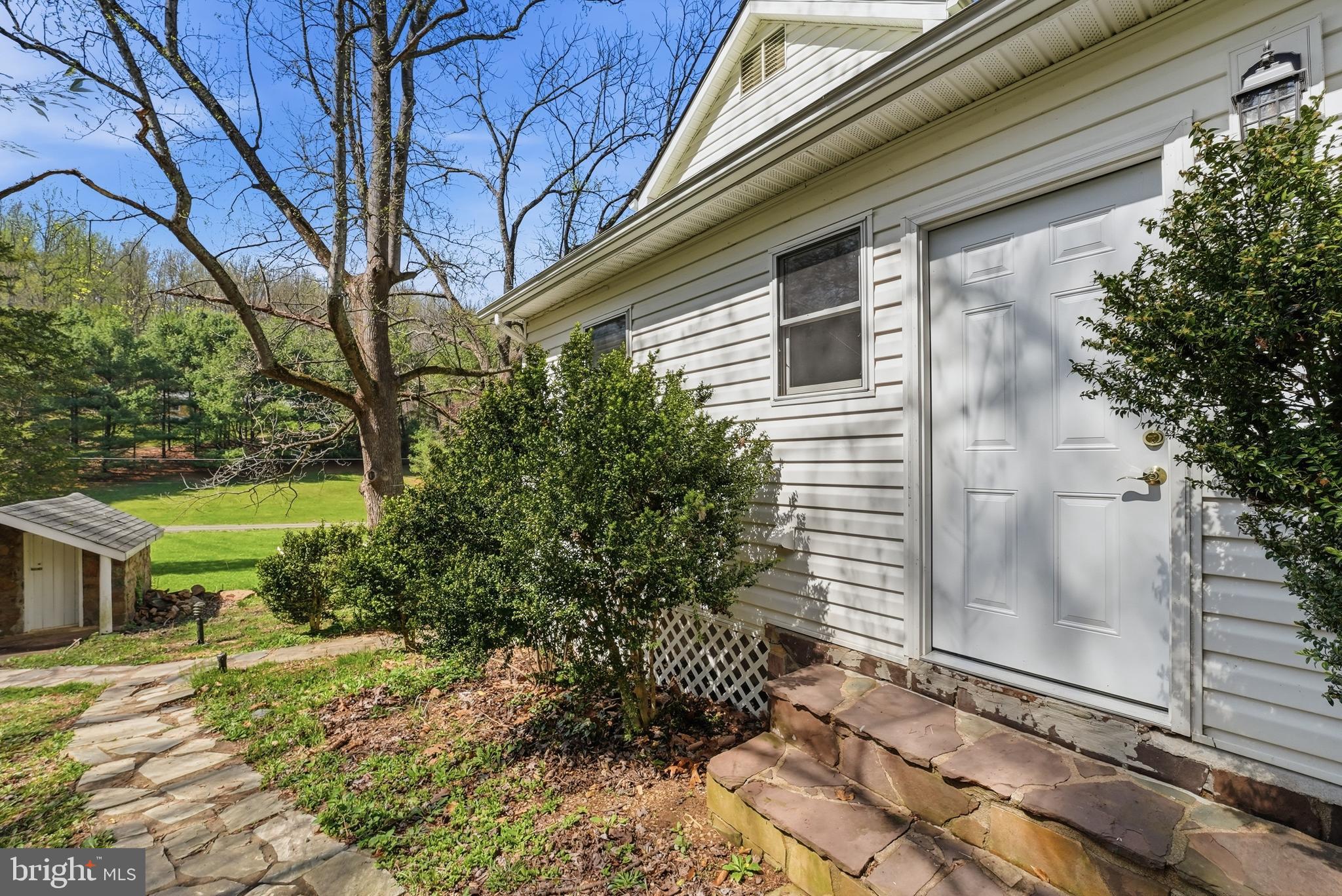 6537 Watery Mountain Road Warrenton, VA 20186 - Photo 4 of 44 a yellow house with trees in front of it