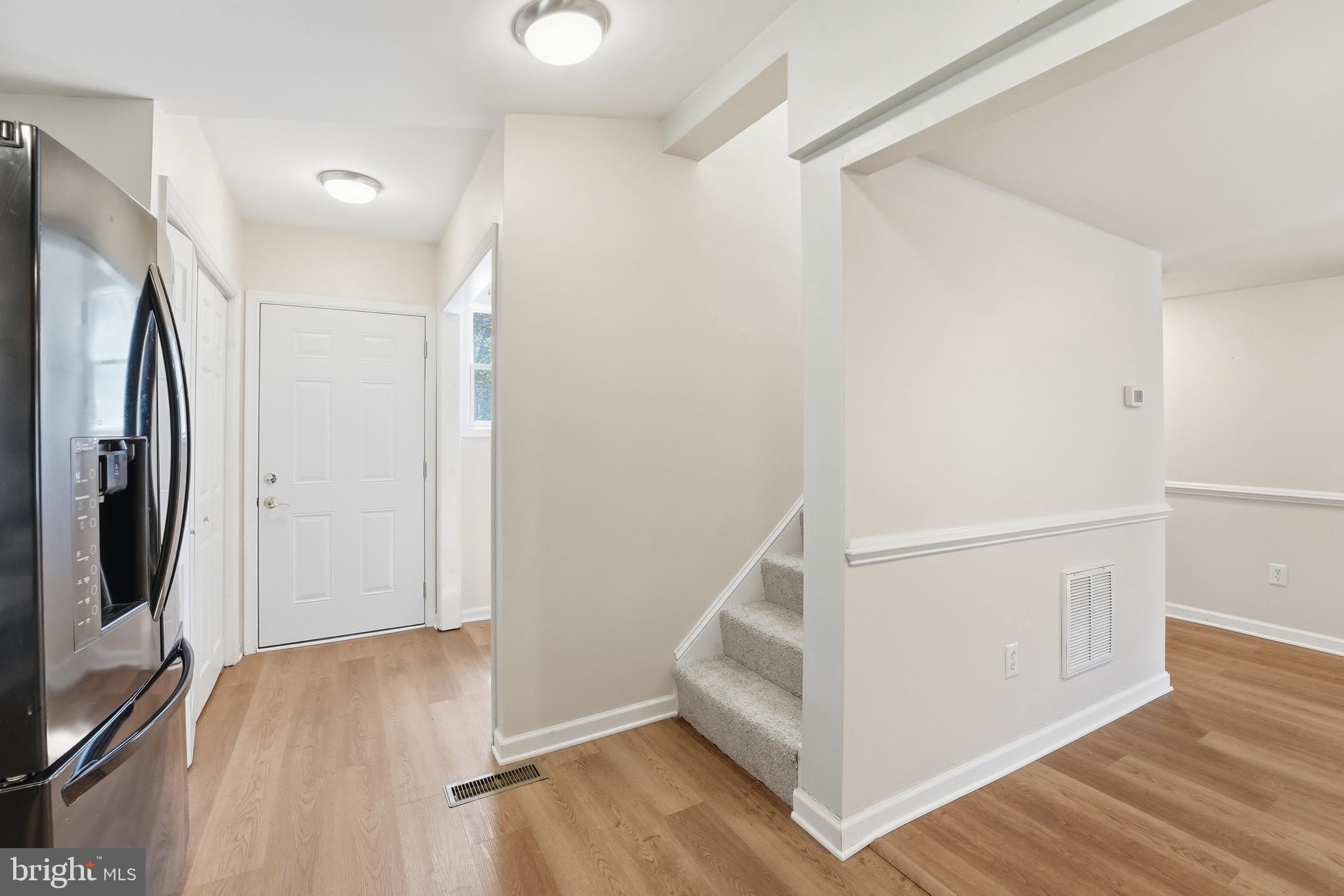 6537 Watery Mountain Road Warrenton, VA 20186 - Photo 5 of 44 a view of a hallway with wooden floor and entryway